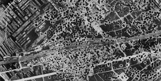 A photographic image showing the pock-marked landscape of a Japanese urban center that had been pelted by bombs from an indiscriminate bombing raid.