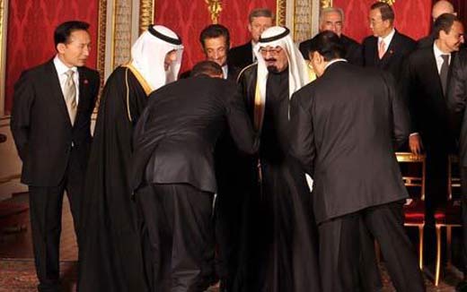 Photographic image of President Obama of the United States bowing before King Abdullah of Saudia Arabia in the company of other heads-of-state at the April 2009 G20 Summit in London.